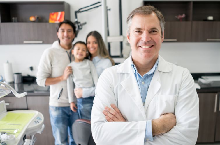 Dentist capturing a memorable moment with a joyful family